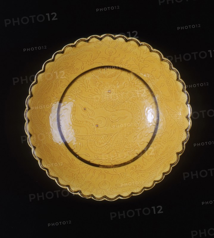Yellow glazed dragon saucer, late Qing dynasty, China, 1870-1920. Artist: Unknown