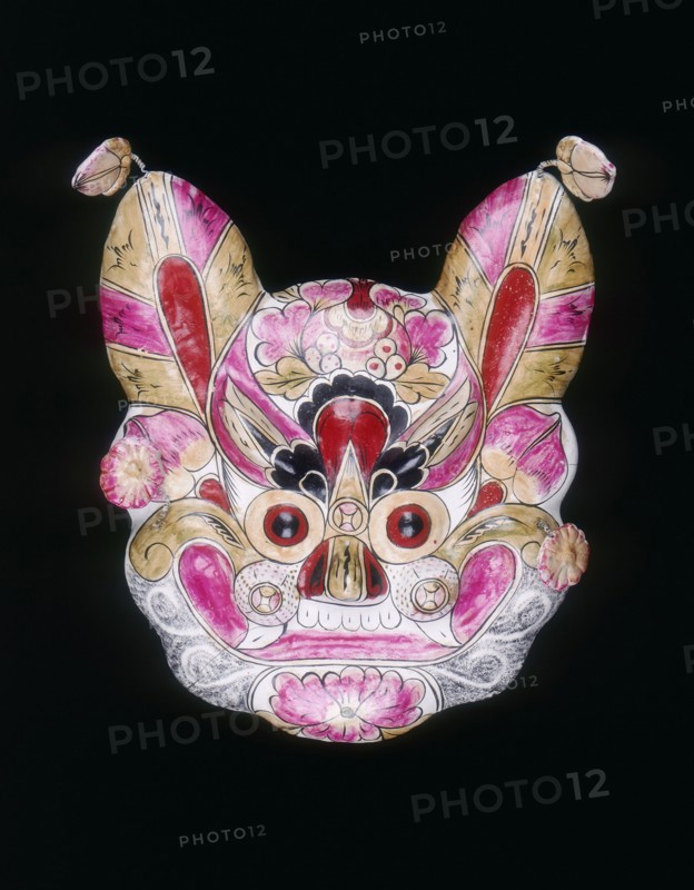 A tiger face mask painted with garish colours, China, 20th century. Artist: Unknown