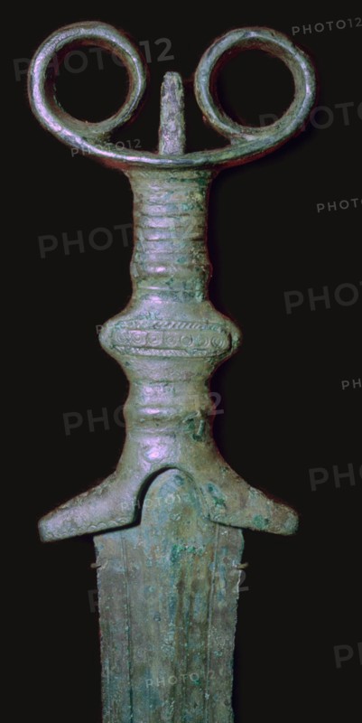 Hilt of an early bronze sword, 7th century BC.