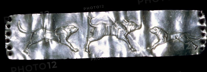 Parthian silver plaque of two dogs and a boar.