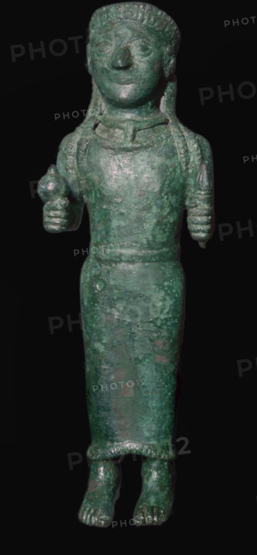 Greek bronze figure holding a pomegranate. Artist: Unknown