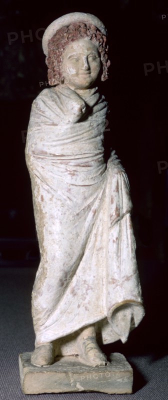 Greek terracotta figure of a boy, said to be from Tanagra, Boeotia, Greece, c300BC- 250BC. Artist: Unknown