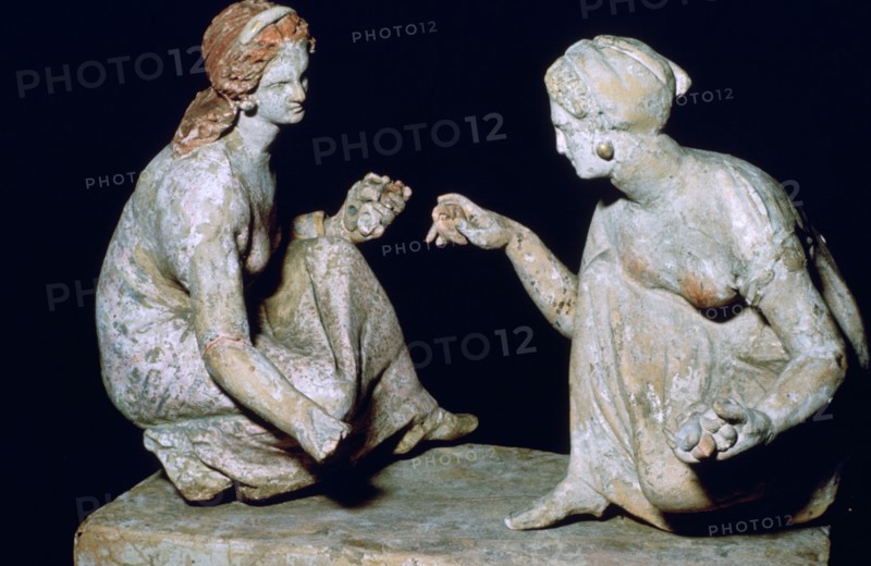 Terracotta group of 'knucklebone' (astragalos) players, Hellenistic Greek, c330-c300 BC. Artist: Unknown