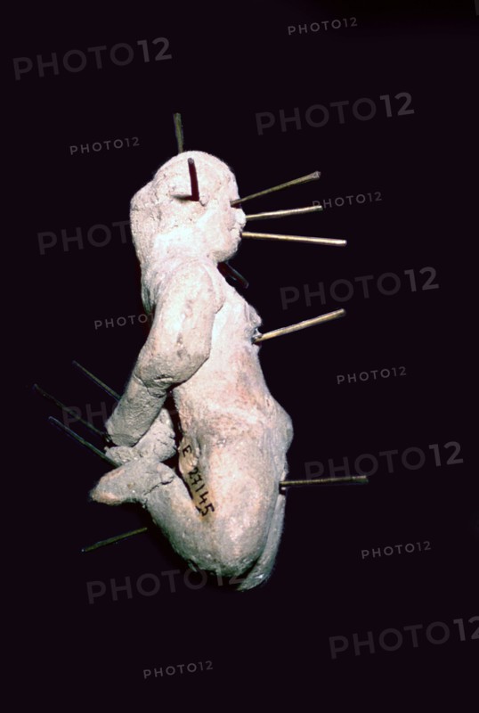 Egyptian clay figure stuck with pins. Artist: Unknown