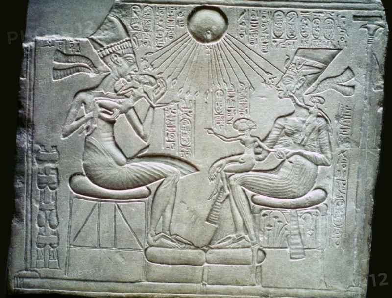 Egyptian relief of Akhenaten and Nefertiti holding their daughters, 14th century BC. Artist: Unknown