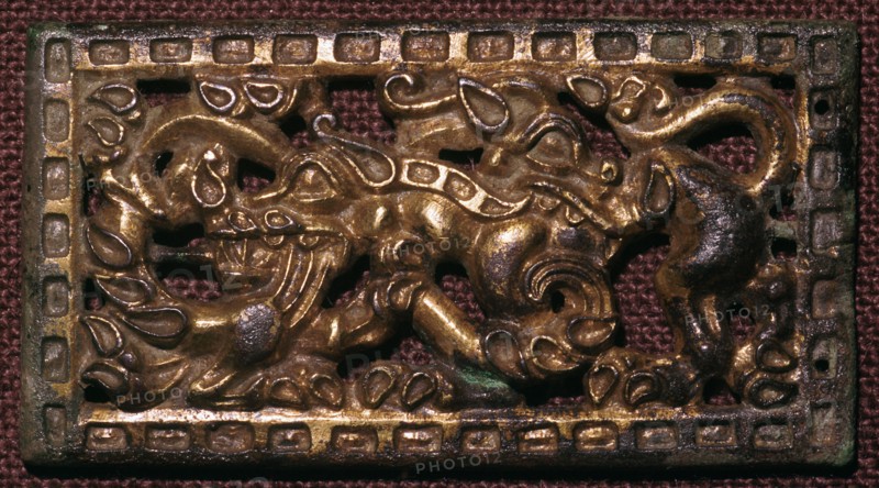 Chinese bronze belt-buckle with animals in combat, 5th century BC. Artist: Unknown