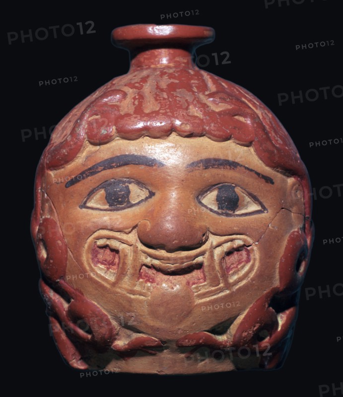 Greek terracotta scent bottle in the shape of a gorgon's head made in Rhodes. Artist: Unknown