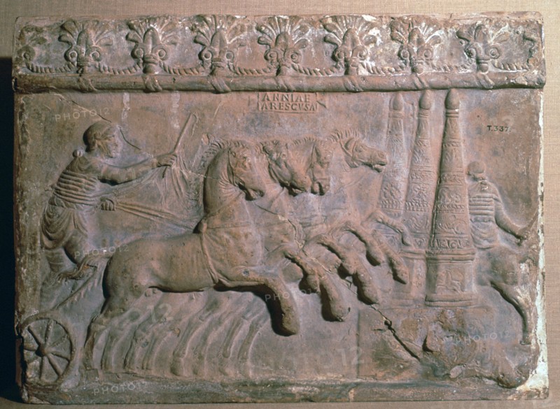 Roman terracotta panel showing a racing chariot. Artist: Unknown