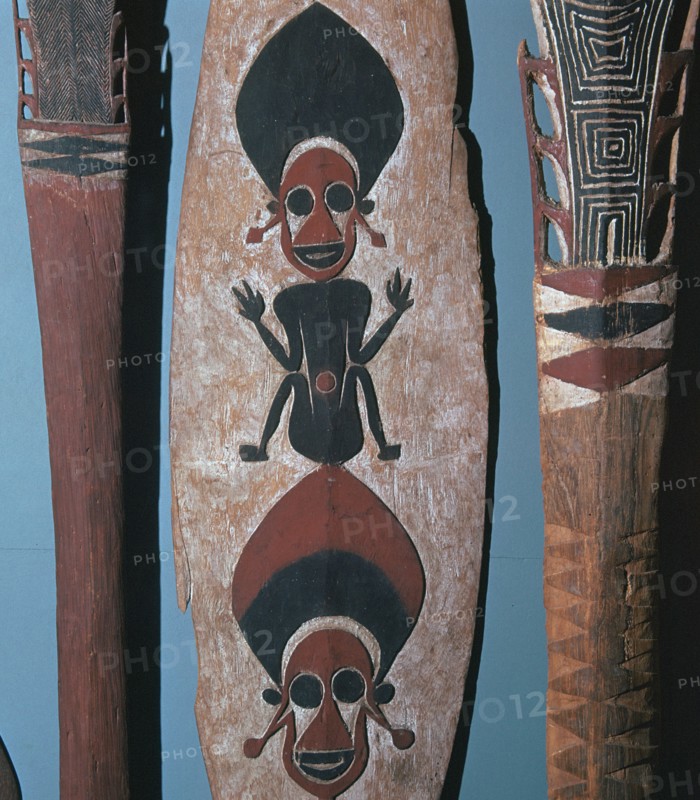 Detail of figures carved and painted on a ceremonial canoe paddle from the Solomon Islands. Artist: Unknown