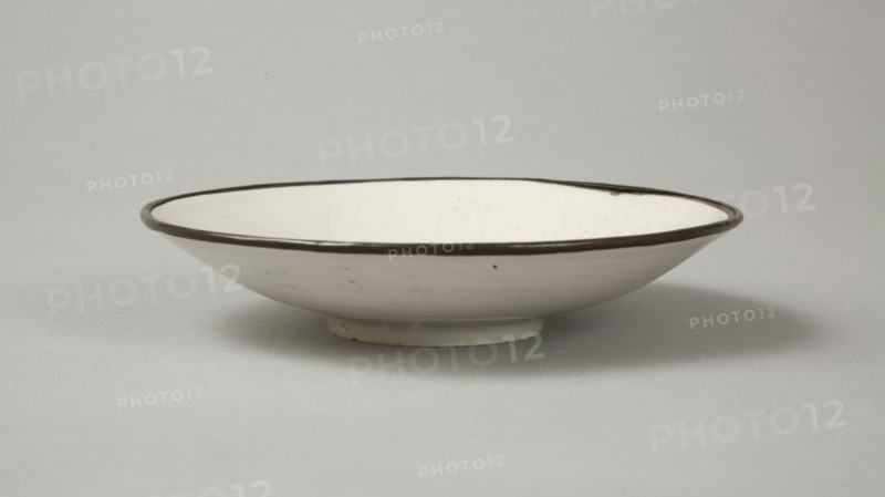 Small Ding-type bowl with incised peony scroll and dragon, 20th century. Artist: Unknown.