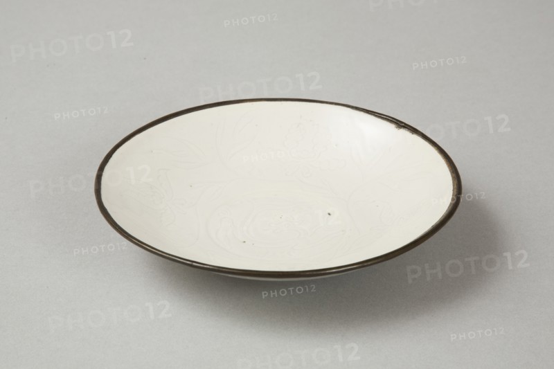 Small Ding-type bowl with incised peony scroll and dragon, 20th century. Artist: Unknown.