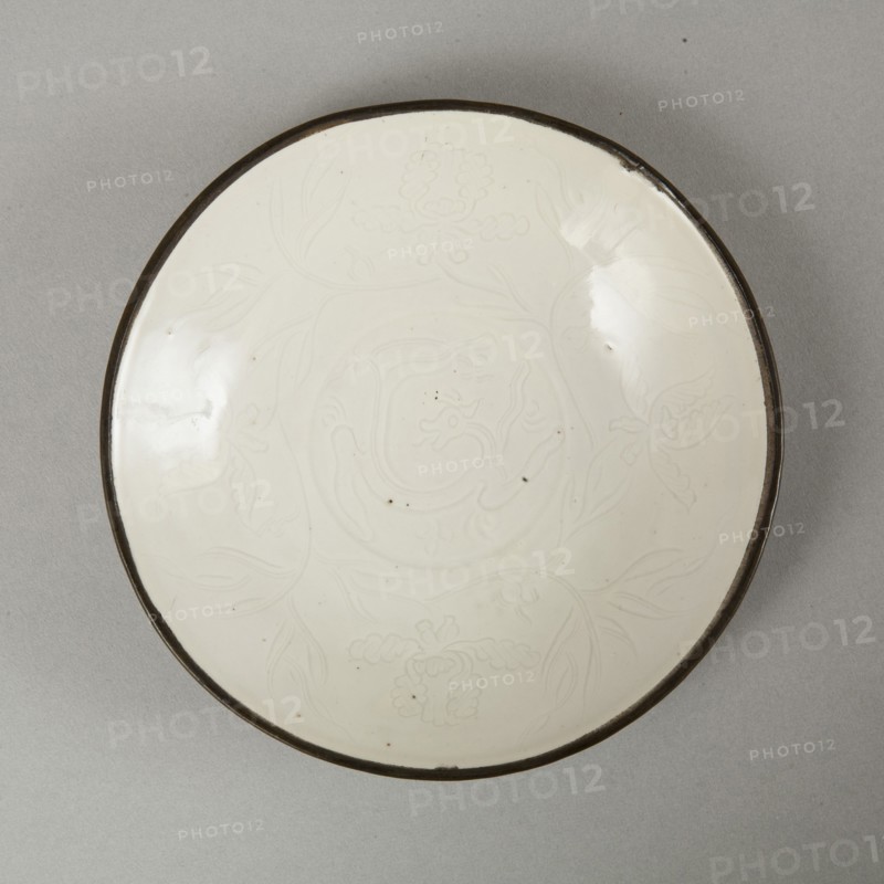Small Ding-type bowl with incised peony scroll and dragon, 20th century. Artist: Unknown.