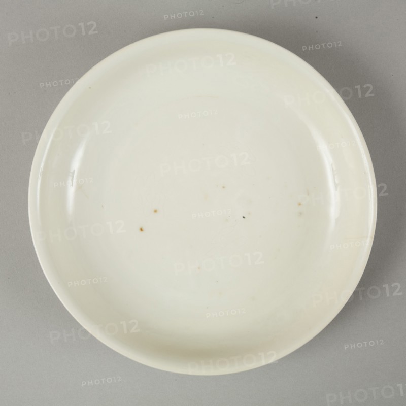 White dish with anhua design of two phoenix and cloud scroll design, Song dynasty, c.1300. Artist: Unknown.