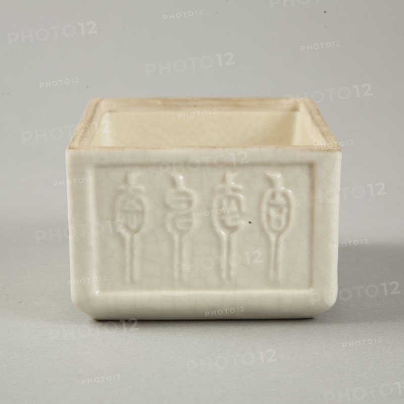 Soft paste rectangular vessel with characters in relief, early 19th century. Artist: Unknown.