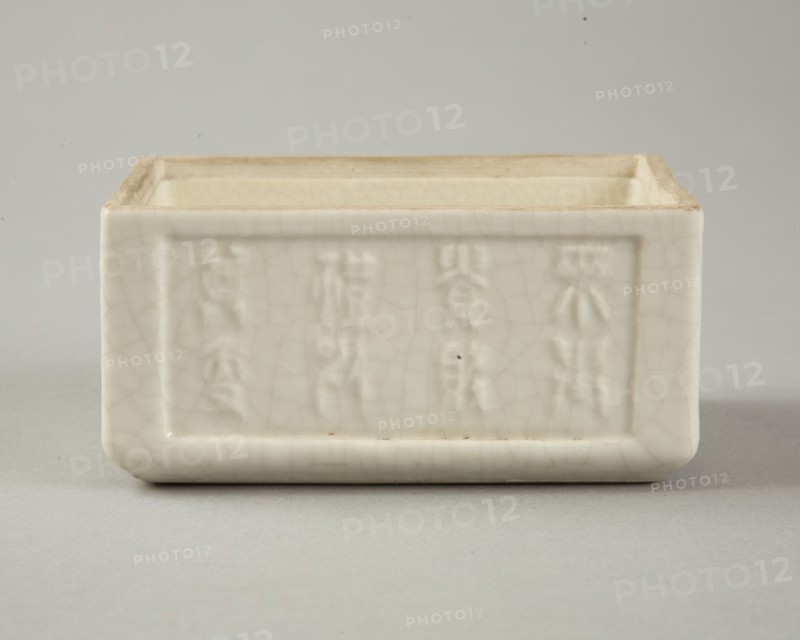 Soft paste rectangular vessel with characters in relief, early 19th century. Artist: Unknown.