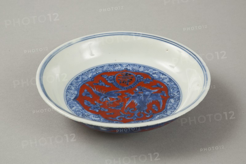 Red clobbered blue and white saucer with stork, phoenix and dragons, Jiajing (1522-1566). Artist: Unknown.