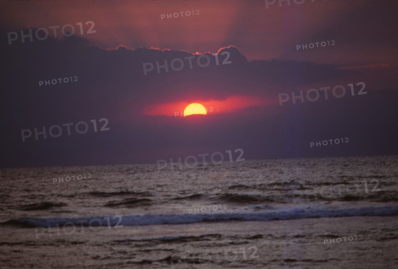 Sunset over Indian Ocean in Hikkaduwa, Sri Lanka, 20th century. Artist: CM Dixon.