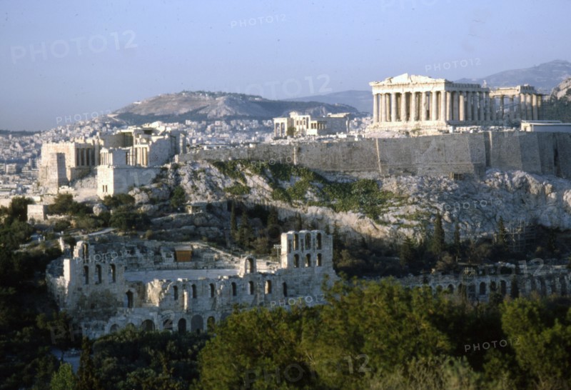 Acropolis and Theatre of Herodes Atticus, Athens from Philopappos Hill at dusk, c20th century. Artist: Unknown.