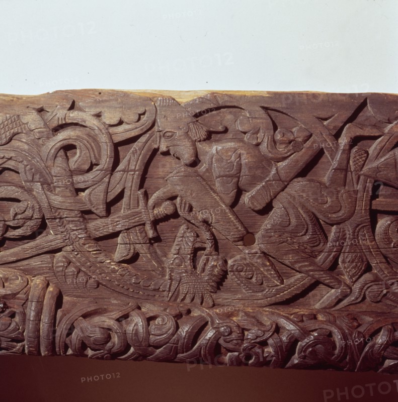 Sigurd kills the Dragon, Fafnir. Detail of wood panel of Hylestad Church, Norway.  Artist: Unknown.