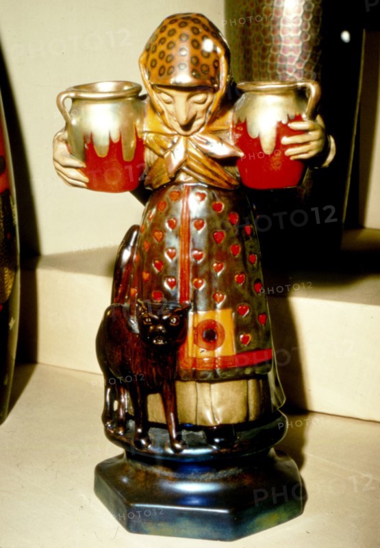 Witch and Cat: Pottery figure from Pecs, Hungary. 19th century. Artist: Unknown.