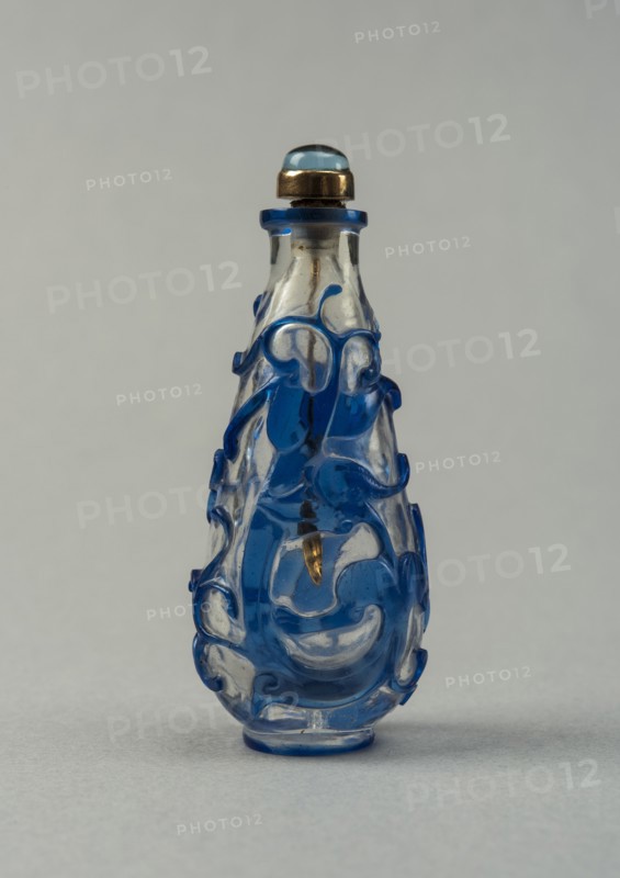Clear glass snuff bottle with blue overlay, China, Qing dynasty, 1644-1911. Creator: Unknown.