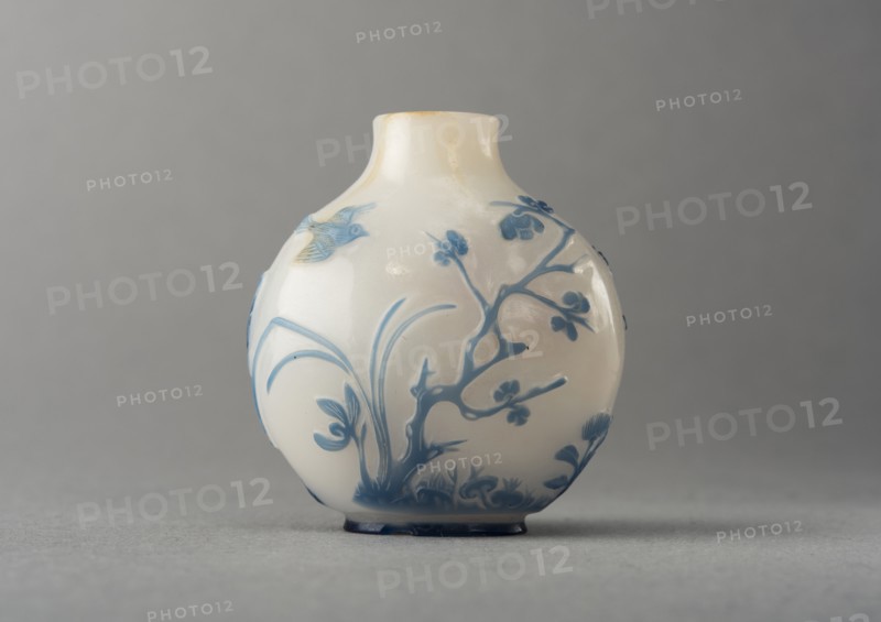 White glass snuff bottle with blue overlay, China, Qing dynasty, 1644-1911. Creator: Unknown.