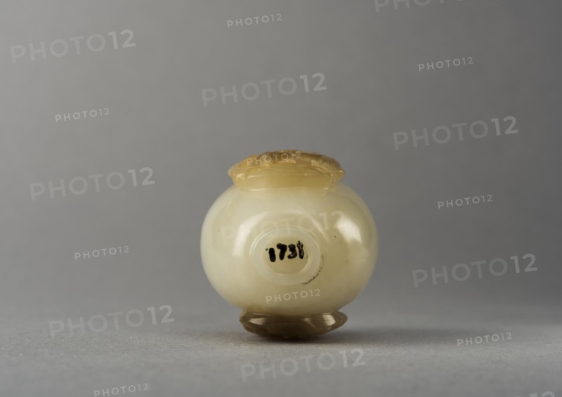Jade snuff bottle with raised carving of animals, China, Qing dynasty, 1644-1911. Creator: Unknown.