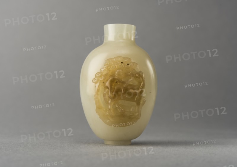 Jade snuff bottle with raised carving of animals, China, Qing dynasty, 1644-1911. Creator: Unknown.