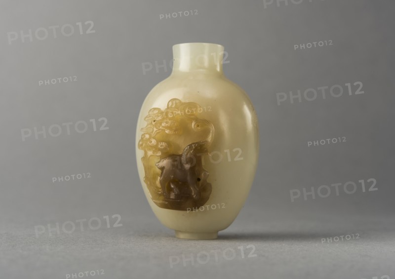 Jade snuff bottle with raised carving of animals, China, Qing dynasty, 1644-1911. Creator: Unknown.