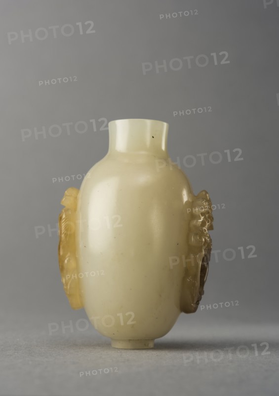 Jade snuff bottle with raised carving of animals, China, Qing dynasty, 1644-1911. Creator: Unknown.