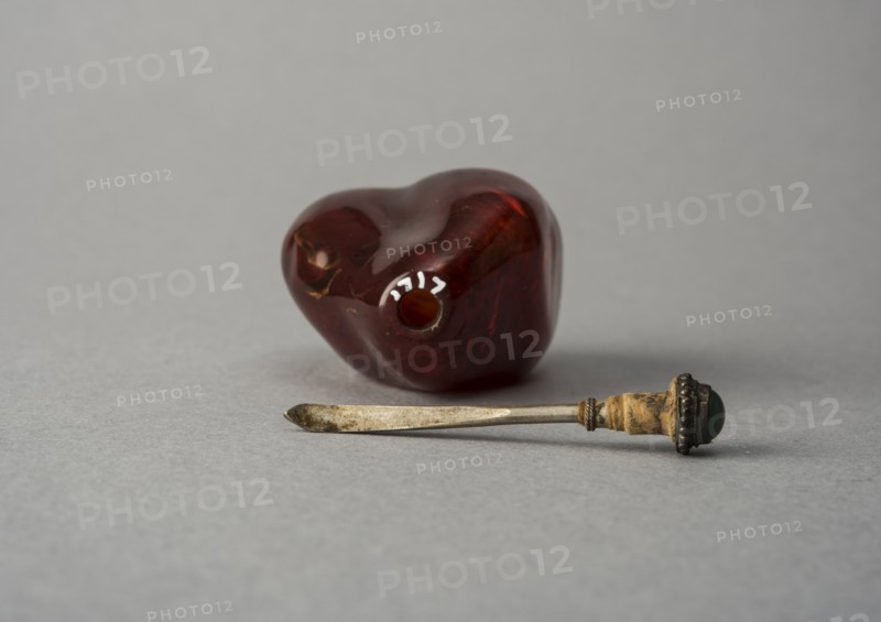 Amber snuff bottle of natural pebble form, China, Qing dynasty, 1644-1911. Creator: Unknown.