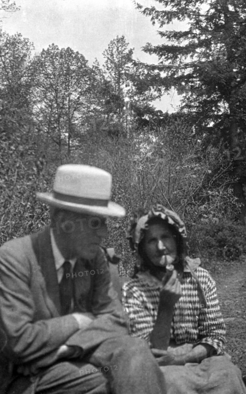 Cecil Sharp and Aunt Betsy smoking pipes, Appalachia, USA, c1917. Artist: Unknown