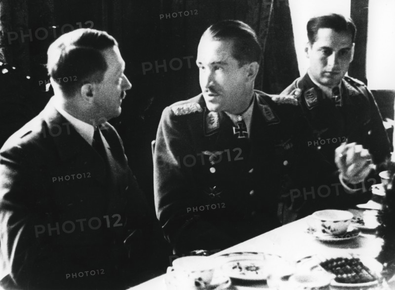 Adolf Hitler in conversation with German air force fighter ace Adolf Galland, 1941. Artist: Unknown