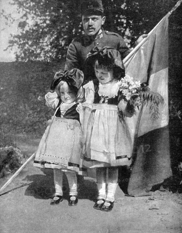 Young Alsatian children in traditional dress with a French soldier, World War I, 1915. Artist: Unknown