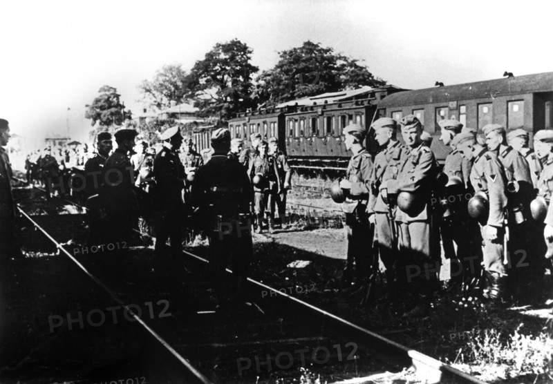 German soldiers awaiting transportation in a railway station in the Paris suburbs, August 1940. Artist: Unknown