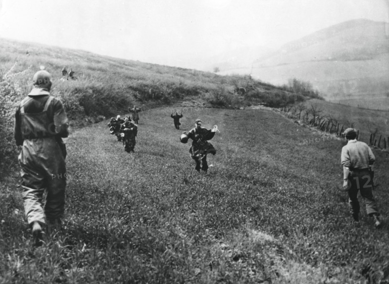 German troops surrendering to soldiers of the American 1st Army, near Elsborn, Germany, April 1945. Artist: Unknown
