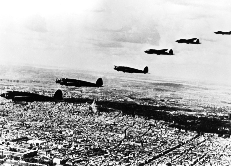 Squadron of German Heinkel He 111 bombers flying over occupied Paris, July 1940. Artist: Unknown
