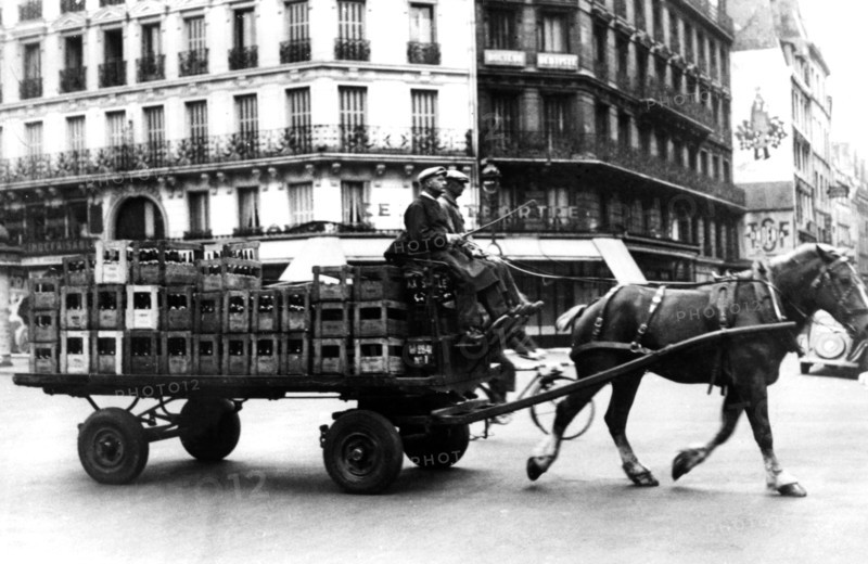 Horse-drawn cart carrying crates of drink, German-occupied Paris, July 1940. Artist: Unknown