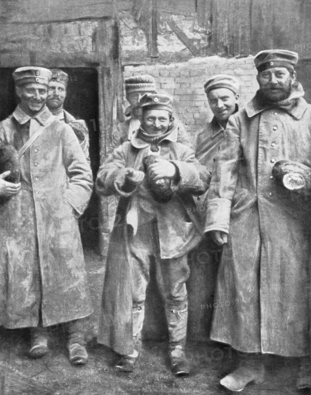 German prisoners of war with their ration of bread, 1915. Artist: Unknown