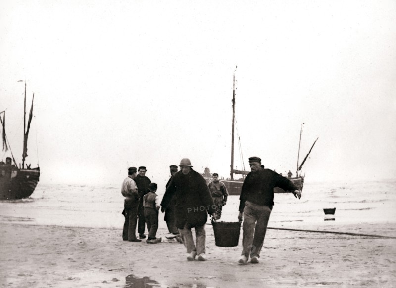 Men on the shore, Scheveningen, Netherlands, 1898.Artist: James Batkin