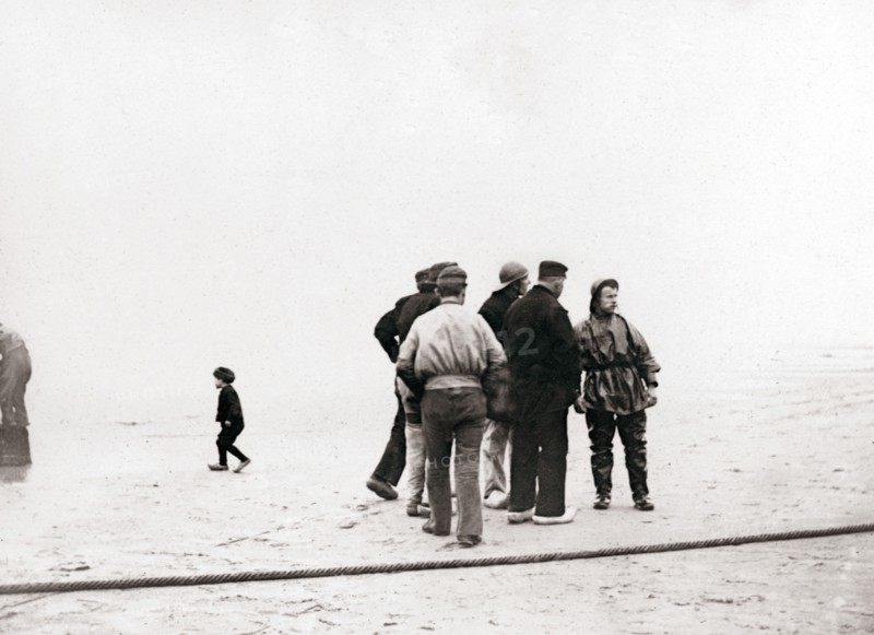 Men on the shore, Scheveningen, Netherlands, 1898.Artist: James Batkin