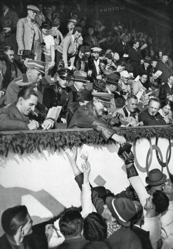 Adolf Hitler signs autographs, Winter Olympic Games, Garmisch-Partenkirchen, Germany, 1936.Artist: Schirner