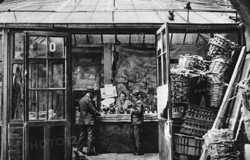 A bar in the Central Market quarter, Paris, 1931.Artist: Ernest Flammarion