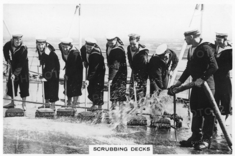 Scrubbing the deck on board HMS 'Nelson', 1937. Artist: Unknown