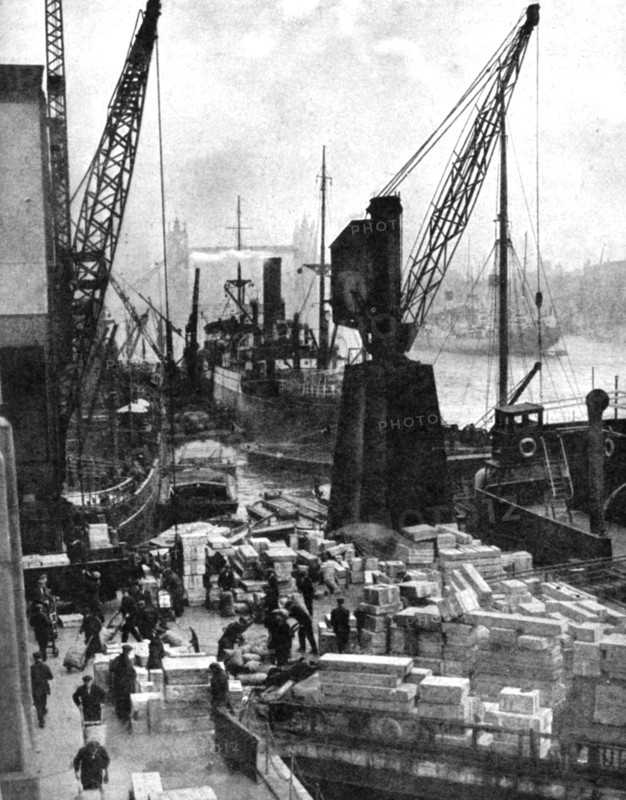 Cargo being unloaded at the docks, Upper Pool, London, 1936.Artist: Fox