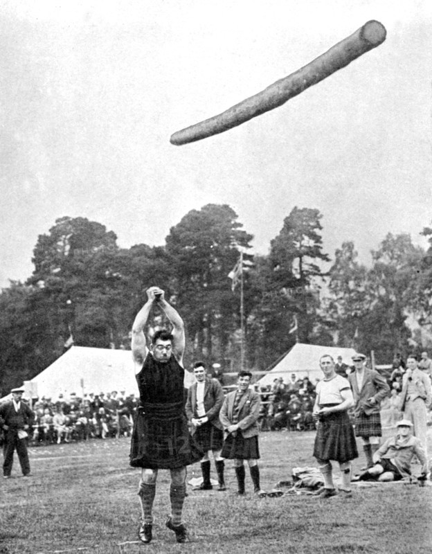Tossing the caber at the Highland games, Scotland, 1936. Artist: Fox