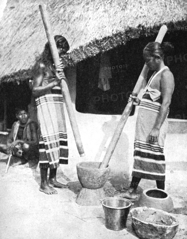 Newar women pounding grain, Nepal, 1936.Artist: Ewing Galloway