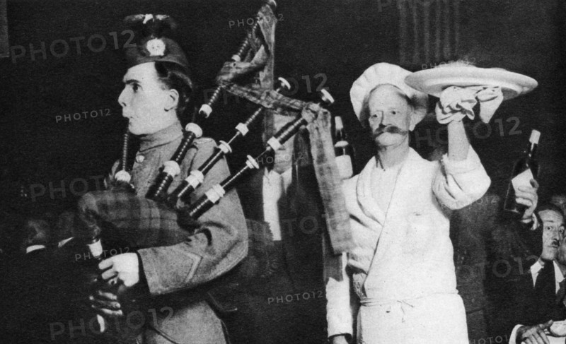 Presentation of the haggis at a Caledonian banquet, London, 1926-1927. Artist: Unknown