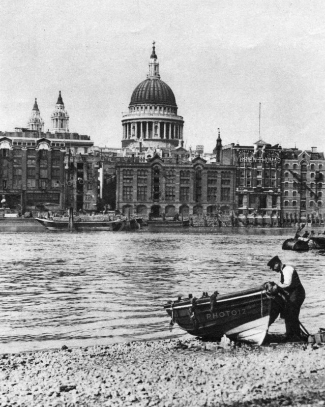 Thames waterman and his boat on the 'beach' at Bankside, London, 1926-1927. Artist: McLeish
