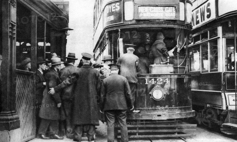 Getting on to a tram at Blackfriars, London, 1926-1927. Artist: Unknown